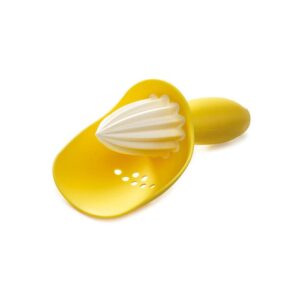 Citrus reamer with pip catcher in yellow by Joseph Joseph for seed-free juicing