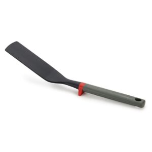 Flexible turner with tool rest in red and grey by Joseph Joseph, non-stick safe