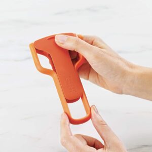 Julienne peeler with blade guard in orange by Joseph Joseph for slicing vegetables safely