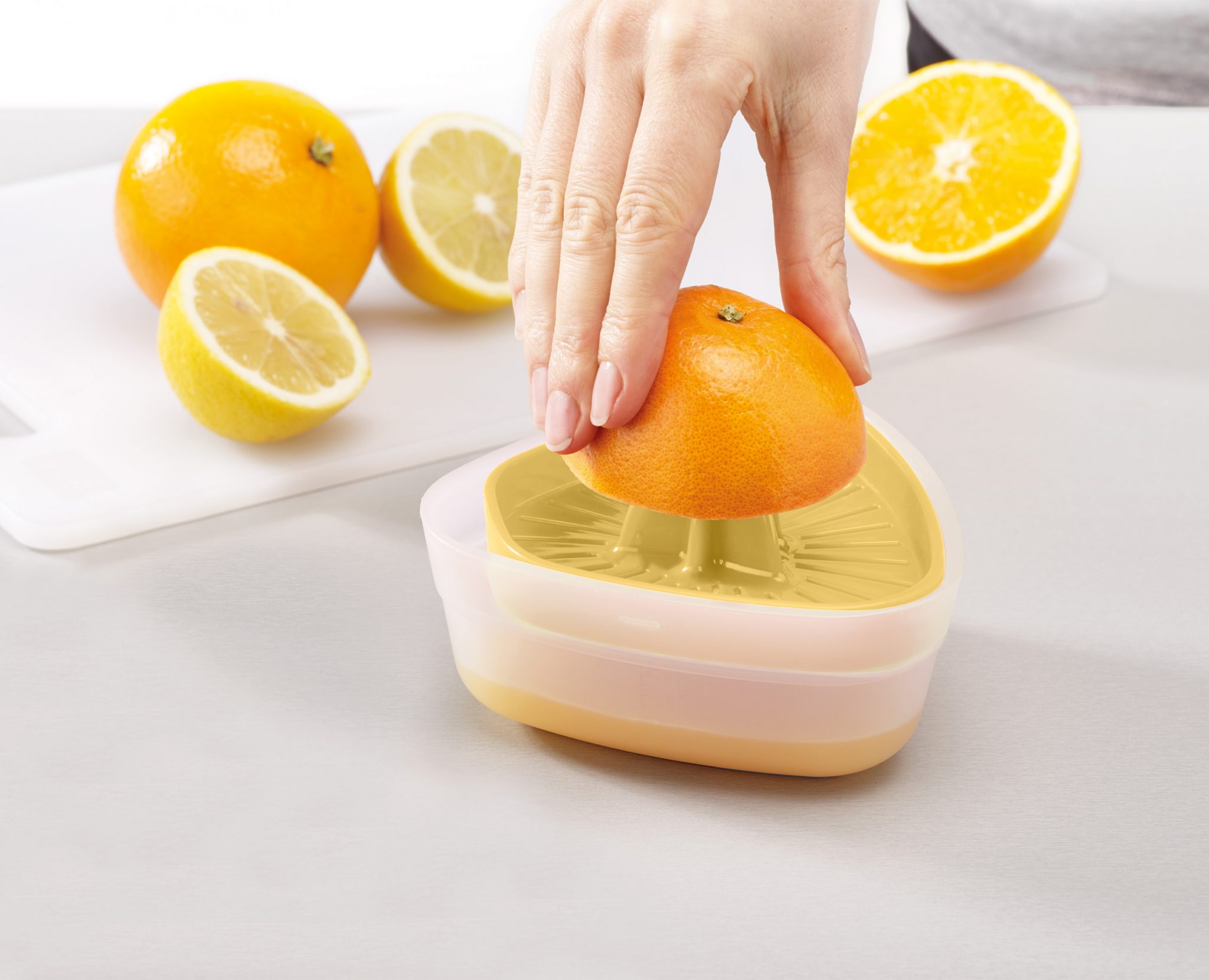 Powerful citrus juicer with BPA‑free reversible lid and non-slip base by Joseph Joseph