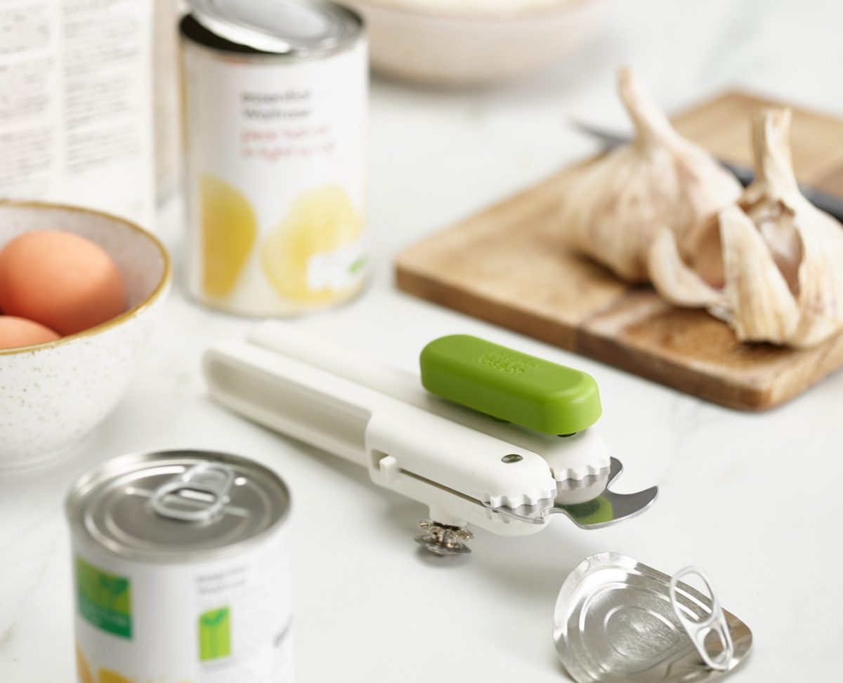 Joseph Joseph 3-in-1 Can Opener in white/green beside open cans