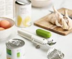 Joseph Joseph 3-in-1 Can Opener in white/green beside open cans