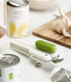 Joseph Joseph 3-in-1 Can Opener in white/green beside open cans