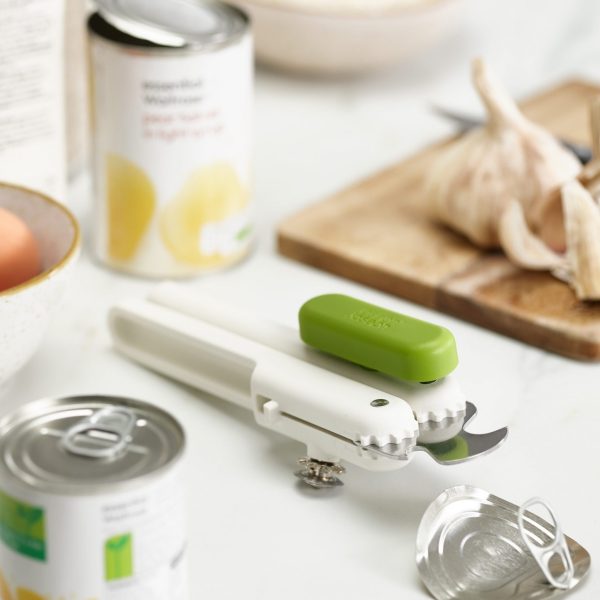 Joseph Joseph 3-in-1 Can Opener in white/green beside open cans