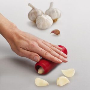 Silicone garlic peeler from Joseph Joseph with textured non-slip surface and roll-to-peel design